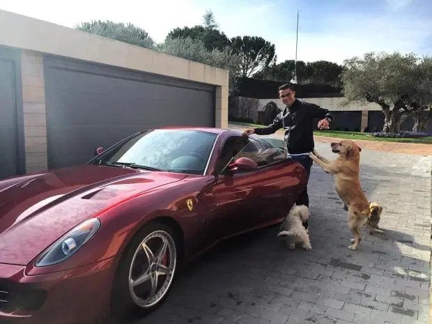 Ronaldo with his red Ferrari